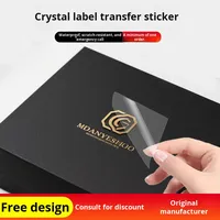 Autocollant de logo personnalisé Étiquette en cristal de transfert UV Film détachable publicitaire auto-adhésif en PVC PVC étanche à chaud pour marque de commerce