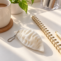 Porte-clés jouet sensoriel anti-stress en TPR blanc, forme dumpling, pour enfants et adolescents de 14 ans et plus, avec chaîne à perles