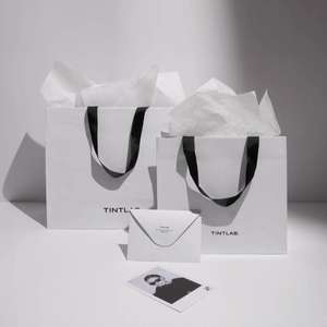 Bolsas de Papel Blancas de Lujo Impresas Personalizadas al por Mayor, Bolsas de Regalo Resistentes para Compras en Tiendas y Boutiques con Cinta - Product Image 1