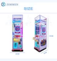 Zormen Máquina de grúa de una sola garra mini con diseño de mapache, gabinete luminoso, operada con monedas, juego de venta sorpresa para fiestas