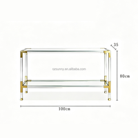 Console moderne de luxe avec plateau en verre trempé ultra-transparent, pieds en acrylique, structure en acier inoxydable brossé doré, idéale pour les couloirs étroits