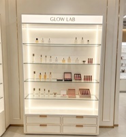Vitrine à parfums en verre chêne clair avec cadre en métal noir, certifiée CE ETL, directement de l'usine, avec éclairage LED et boîte lumineuse pour présentation de cosmétiques