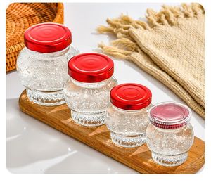 Bon marché Prix Vente en gros Bocal rond transparent de stockage des aliments Bocal <span class=keywords><strong>vide</strong></span> en verre à épices et miel 50ml 100ml <span class=keywords><strong>Mini</strong></span> bocal à <span class=keywords><strong>confiture</strong></span> en verre avec couvercle - Product Image 4