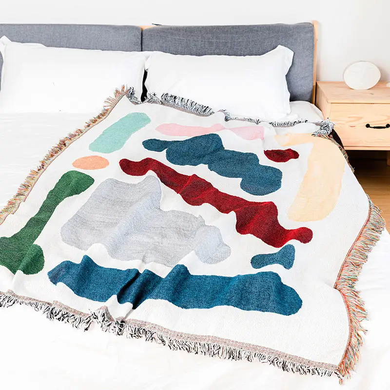 Vente en gros de couverture moderne en coton tissé nouveau design tapisserie couverture décorative de canapé avec pompon
