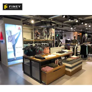 Venta al por menor ropa de deporte de exhibición de tienda de nombres personalizado Mosern tiendas de deportes pantalla Interior de diseño de muebles