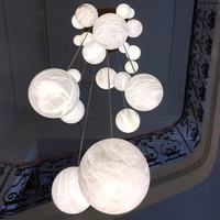 Lustre long en cristal pour escalier, style chinois moderne, rotatif et ajouré, pour hôtel, villa, duplex, loft, lampe d'escalier simple et moderne