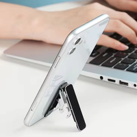 Support Téléphone Portable Pliable Mini Béquille Adhésive Ultra-Fine et Légère Universelle