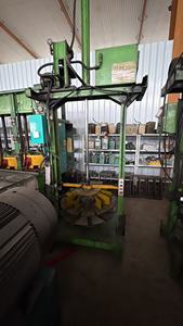 Gebruikt merkloze motorfietsbandenverpakkingsmachine met kerncomponenten zoals tandwielmotor, PLC en motorfietsbandenkrimpmachine. - Product Image 5