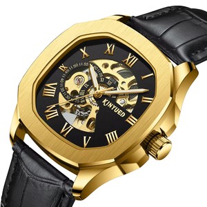 Montre mécanique automatique pour homme KINYUED, boîtier doré, bracelet en cuir, cadran squelette ajouré, double fuseau horaire, luxe, mode, vente en gros - Product Image 1