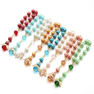 Pulsera Elástica de Moda con Cuentas de Rosario Coloridas y Colgante de Cruz con Alas de Ángel, Regalo Ideal para Fiestas de Niñas y Recuerdo para Baby Shower - Product Image 1