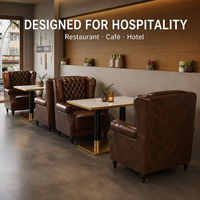 Fauteuil d'angle en cuir de luxe avec dossier capitonné pour salon, fauteuil club avec table en pierre pour café et bar d'hôtel