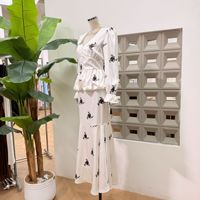 Nouvel ensemble robe style rétro automne pour femme : haut à col en V et manches longues amincissant la taille, et jupe queue de poisson