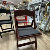 Chaise de salle à manger pliable en résine plastique, capacité de charge élevée, empilable et portable pour la location d'hôtels et de salles de réception