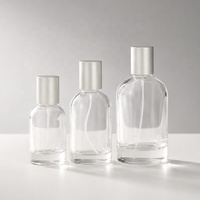 Flacon de parfum rond en verre vide de luxe de 50 ml, rechargeable, avec pulvérisateur à pompe, design personnalisé en option