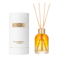 Bouteille diffuseur d'aromathérapie en verre rond de 120 ml en gros avec bâtonnets en rotin naturel pour personnalisation de parfum d'intérieur