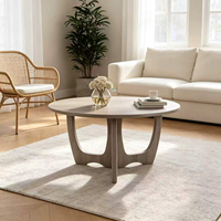 Table basse ronde moderne avec base sculpturale, table centrale polyvalente pour salon, pièce d'appoint élégante pour toute décoration intérieure