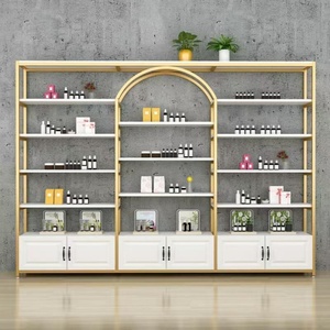 Estantes de Cosméticos de Diseño Moderno, Exhibidores de Cosméticos Dorados para Tiendas Minoristas con Gabinete, Personalización de Logotipo y Tamaño - Product Image 1