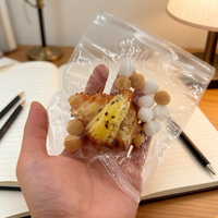 Jouet anti-stress en TPR souple en forme de croissant au caramel, à remontée lente, pour adultes