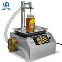Machine de remplissage de liquides visqueux de type pesage à flux pour miel, sauce au sésame, huile comestible, colle