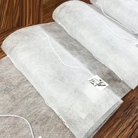 Sachet à thé jetable en tissu filtrant pour rouleau de fibre de maïs Sac triangulaire non tissé en PLA avec étiquette