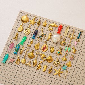 Colgante de concha de vieira de acero inoxidable chapado en oro hipoalergénico con temática de Manna Ocean con dijes de verano - Product Image 3