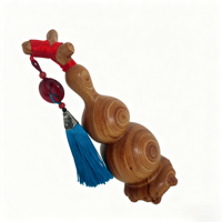 Sculpture artisanale en bois de calebasse symbolisant la chance, l'harmonie et la prospérité pour une décoration élégante de la maison et du bureau