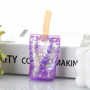 Jouet anti-stress souple et compressible en forme de bâtonnet de crème glacée à paillettes effet sable mouvant - Acheter - Product Image 5