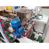 Machine d'emballage automatique de type robot à chargement par le haut pour boîtes et cartons