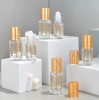 Top Grade 3ml 6ml 12ml vide doré octogonal huile essentielle rouleau bouteille feuille-motif verre rouleau sur bouteille de parfum