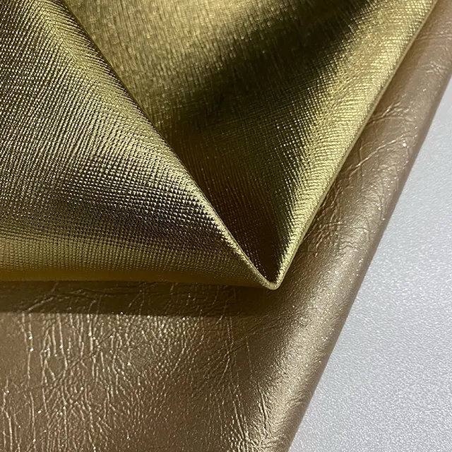 Tela de cuero dorado brillante para decoración, nuevo diseño Popular, bordado, para silla de salón, tapicería