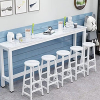 Ensemble table et chaises murales modernes en bois massif et structure en fer pour usage commercial, idéal pour balcon, salon de thé, ou espaces étroits (table longue à bord fin)