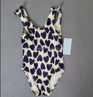 Fabricants de maillots de bain Kids Texture personnalisés en gros Toddler Girls Maillot de bain anti-UV à volants Maillot de bain une pièce avec nœud papillon