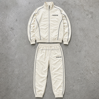 Ensemble deux pièces décontracté pour homme, personnalisé, crème, col montant, fermeture éclair sur le devant, avec passepoil contrastant et pantalon à cordon de serrage, OEM ODM