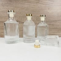 Diffuseur de parfum d'ambiance de luxe 100ml 200ml en verre transparent sérigraphié avec bouchons en verre doré personnalisables