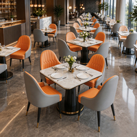 Chaise de salle à manger bicolore orange et gris, table en marbre avec piétement, mobilier de restaurant contemporain personnalisable en or pour hôtel, vente en gros