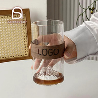 Verre à long drink créatif transparent en forme de montagne avec base ambrée, pour bière, whisky, café, avec manchon en bois