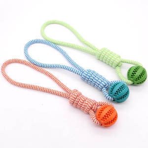 Balle de jeu durable en caoutchouc pour chien, pour le nettoyage des dents, la distribution de friandises, l'entraînement à la mastication et au tirage, avec nœud de tirage et fonction de distribution de nourriture - Product Image 1