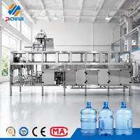 Machine d'embouteillage d'eau en fûts de 5 gallons 600BPH avec ligne intégrée de lavage, remplissage et bouchage pour la production de petites quantités d'eau potable
