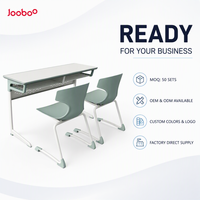 Bureau et chaise scolaires doubles modernes pour adultes avec siège en PP et structure en acier, design écologique et durable pour les collèges et universités