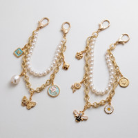 Bijoux fantaisie : Porte-clés en chaîne dorée avec perles et breloques interchangeables (abeille, fleur, marguerite) – Charme de sac pour femme