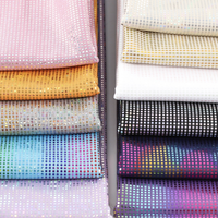 Stock de lots de verre sattré brillant hologramme irisé feuille métallique tissu poly spandex extensible dans les 4 sens jupe de danse tissu de maillot de bain