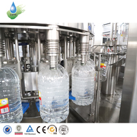 Machine automatique 3 en 1 pour le soufflage, le rinçage, le remplissage, le bouchage, l'étiquetage et l'emballage de bouteilles en plastique PET de 3L, 5L, 8L et 10L pour l'eau potable