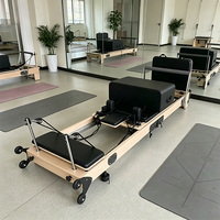 Lit de Pilates pliable professionnel avec barre de repose-pieds réglable en érable pour instructeurs et cliniques