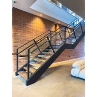 Escalier Prima en acier au carbone avec garde-corps en verre pour villa, hôtel, escalier courbé commercial