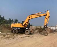 Excavatrice d'occasion à vendre : Excavatrice sur roues Hyundai 210W-7 de 21 tonnes, modèles 210 et 220, idéale pour la construction, disponible à Shanghai.