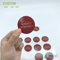 Autocollants ronds personnalisés en PP avec face brillante bordeaux et impression en police sérifée pour scellage de produits et ensembles d'impression d'emballages, vente en gros