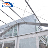 Tente transparente de luxe 6x15M 6x20M 6x25M avec porte en verre pour les événements clients vip cinq étoiles