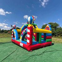 Château gonflable robuste de qualité commerciale sur le thème du clown de cirque joyeux et coloré pour les fêtes d'enfants et les carnavals