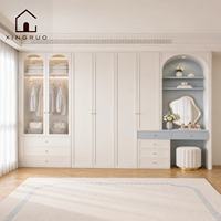 Armoire de rangement XINGRUO bleu crème avec portes cannelées, éclairage LED, coiffeuse et design cintré pour chambre à coucher, style européen