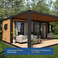 Maison modulaire préfabriquée en conteneur avec terrasse, panneau mural en bois grainé à cadre noir CGCH